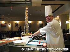 A chef preparing tasting plates